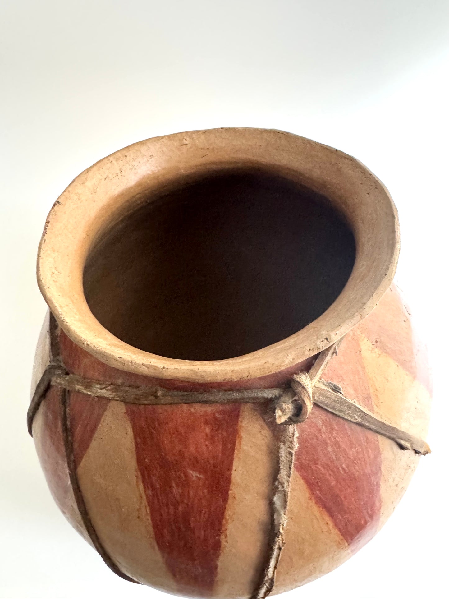 Handmade Tribal Clay Pot with Natural Pigment and Leather Detailing